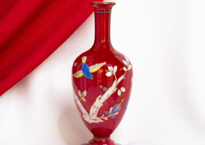 Red Glass Vase With Branches and Birds