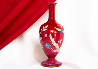 Red Glass Vase With Branches and Birds