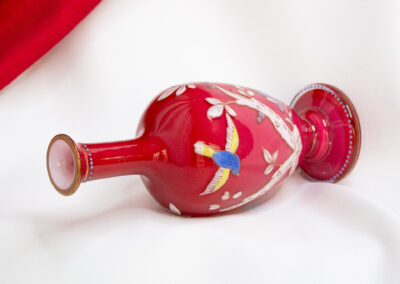 Red Glass Vase With Branches and Birds