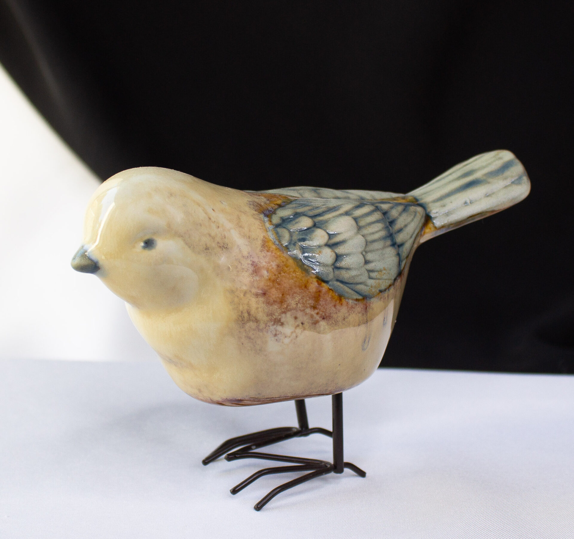 Vintage Stoneware Bird With Detailed Feathers and Metal Feet